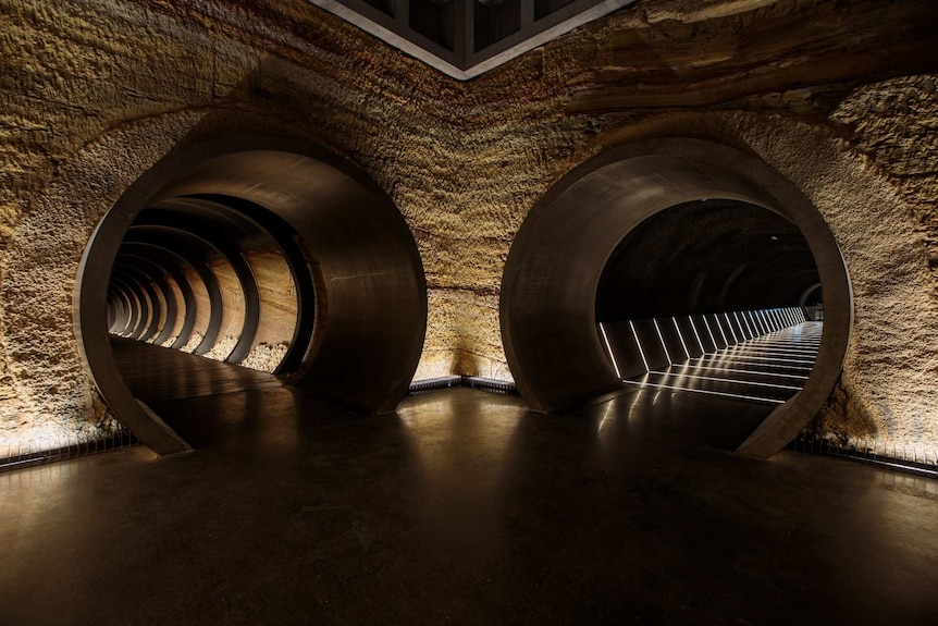 Twin tunnels with dramatic lighting.