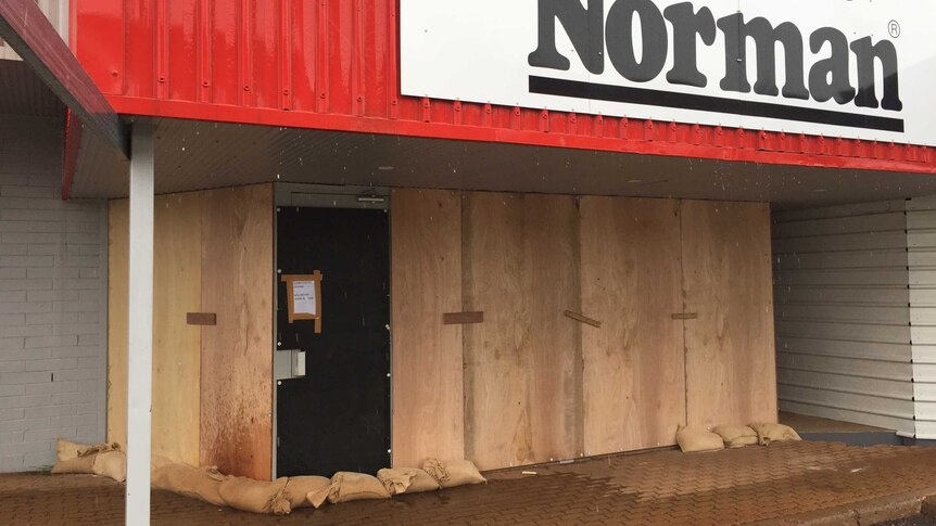 A Harvey Norman store that has been boarded up to protect it from the cyclone.