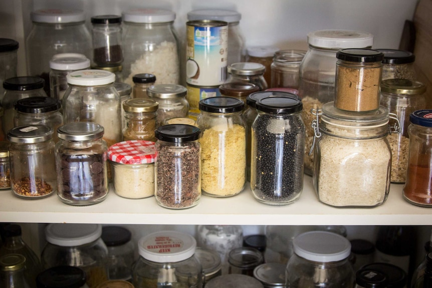 Dry food is stored in glass jars.