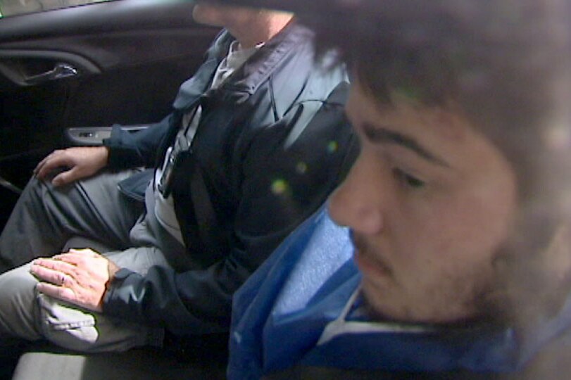 Sevdet Besim inside car being taken into court