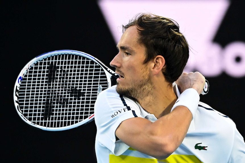 Daniil Medvedev plays a backhand against Stefanos Tsitsipas at the Australian Open in Melbourne.