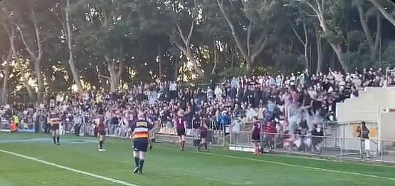 people standing on a stand as it collapses and they fall