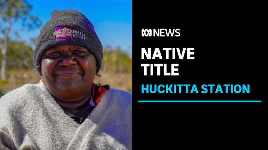 Native Title. Huckitta Station. Woman smiling looking at the camera wearing a beanie.