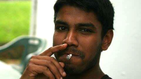 A man smoking a cigarette