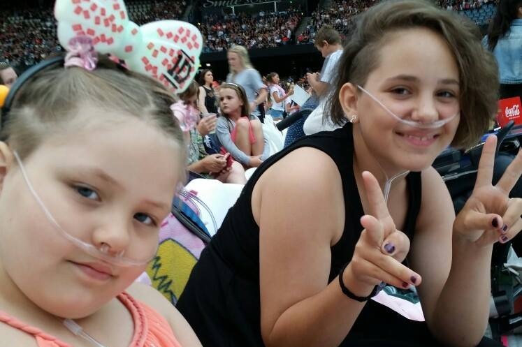 Georgia-Grace and Tabetha Fulton at a stadium concert