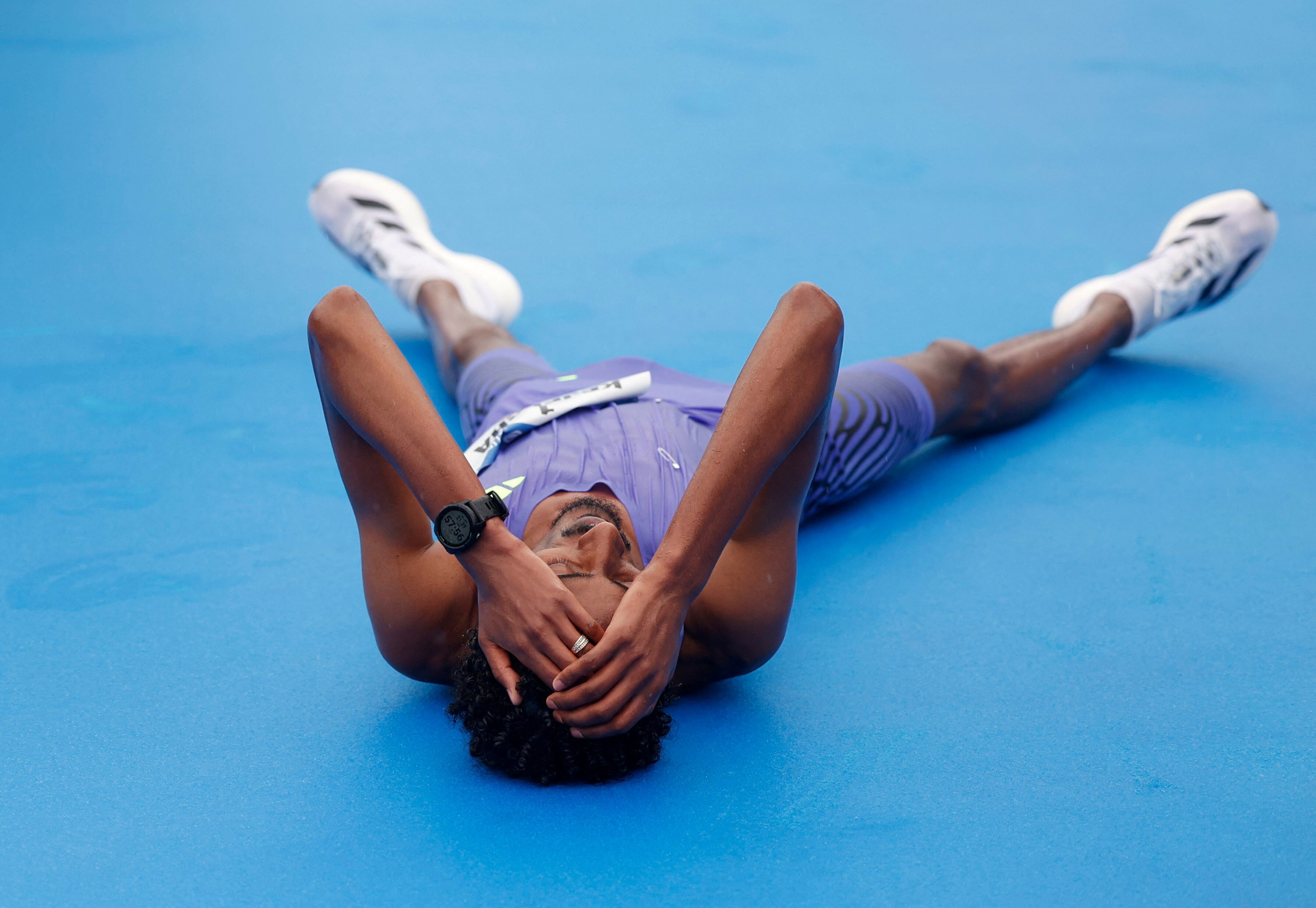 Yomif Kejelcha lies on the ground