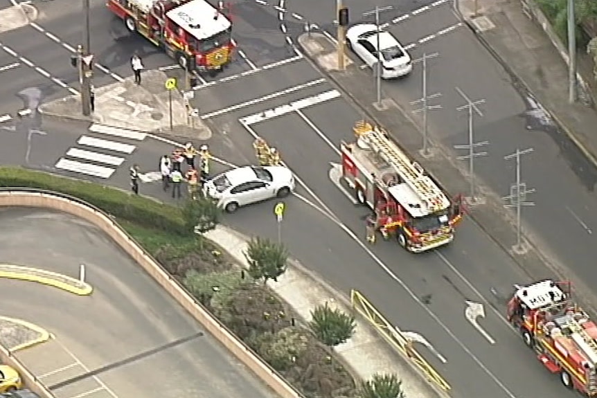 An aerial view showing three fire trucks on a road at Chadstone Shopping Centre.
