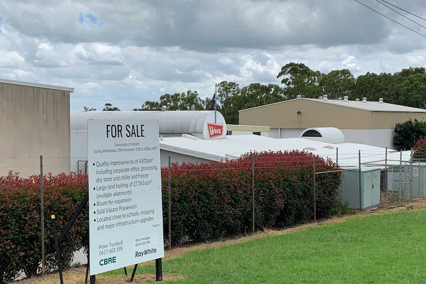 A for sale sign outside the Weis factory January 2021