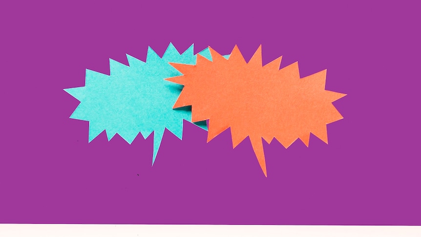 One blue and one orange speech bubble overlapping in mid air over white surface, purple background