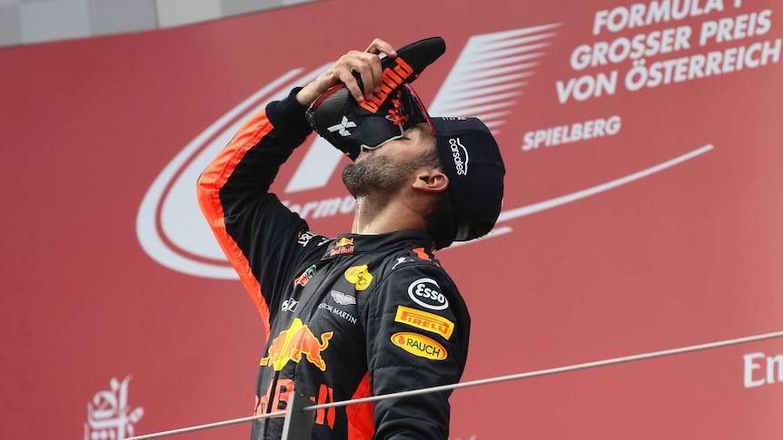 Australia's Daniel Ricciardo does a "shoey" on the podium after the Austrian Formula One Grand Prix.