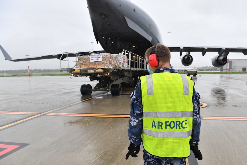 Cargo is loaded onto a plane.