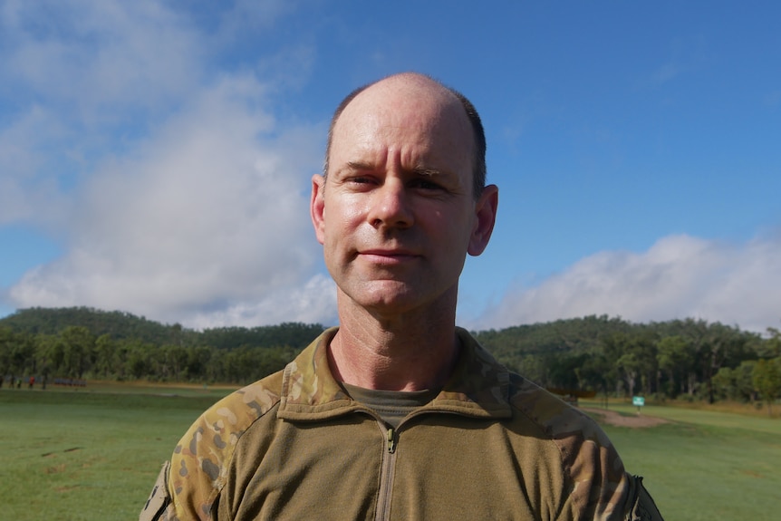 A man wearing army greens