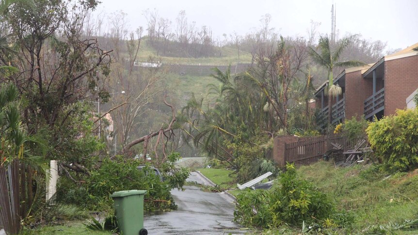 A thunderstorm rolls over Airlie Beach on Wednesday morning, with a major clean-up needed in the town.