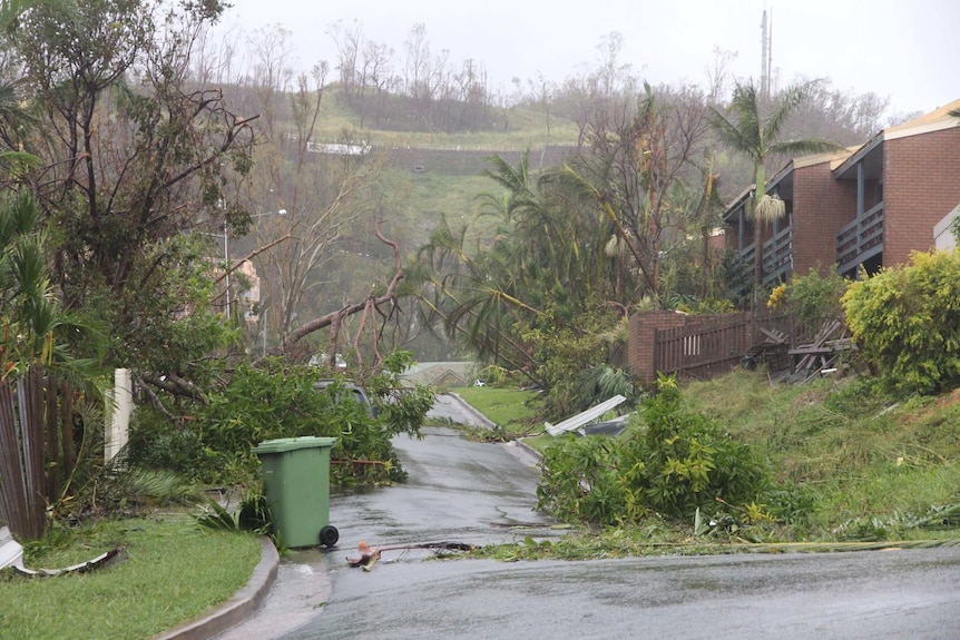 A thunderstorm rolls over Airlie Beach on Wednesday morning, with a major clean-up needed in the town.