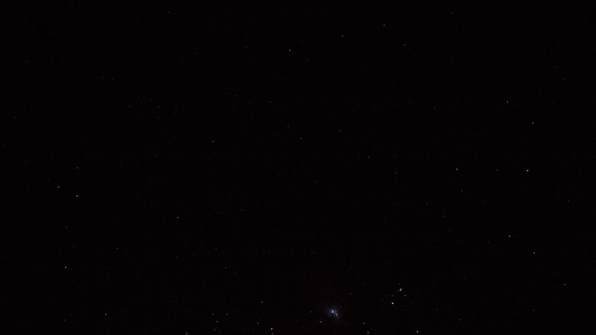 A faint photo of space in which not much detail is visible.