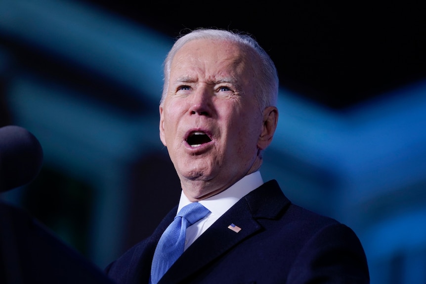 President Joe Biden is seen close up as he delivers a speech.