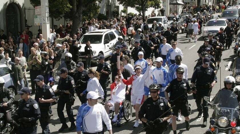 Torch runners make their way slowly along the route in San Francisco