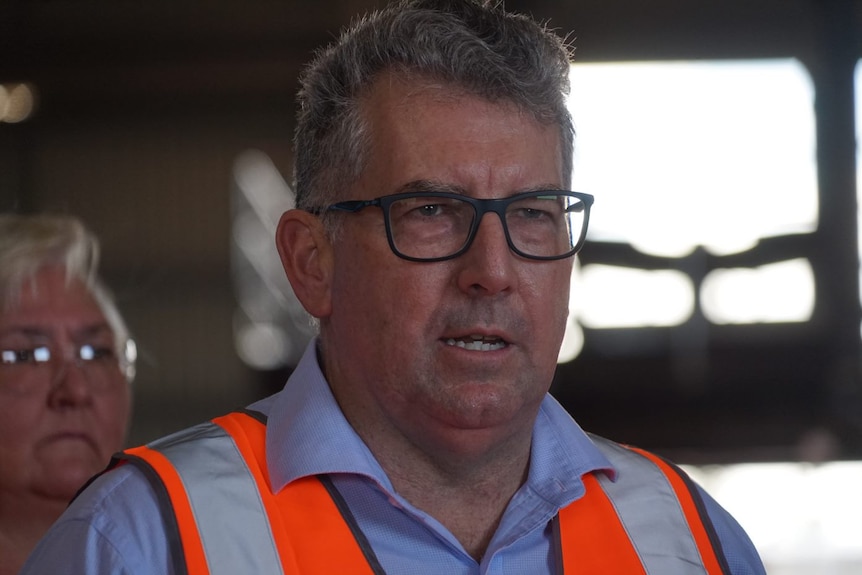 Federal Resources Minister Keith Pitt wears glasses at a press conference in Darwin. 