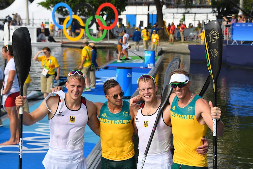 Germany's Max Rendschmidt and Marcus Gross celebrate with Australia's Lachlan Tame and Ken Wallace
