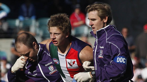 Damaging clash: Nathan Fyfe was involved in a head clash with team-mate Dylan Roberton and didn't return to the fray.