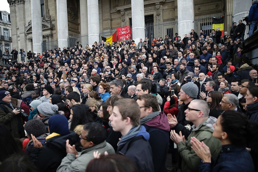 People hold a minute of silence in Brussels.