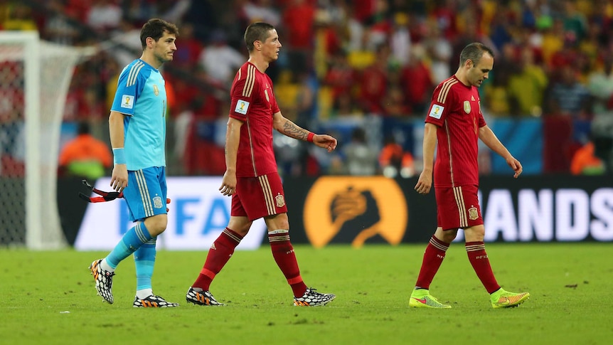 Casillas, Torres and Iniesta trudge off the pitch