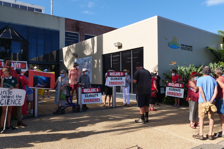 Local climate activits protest outside council chambers