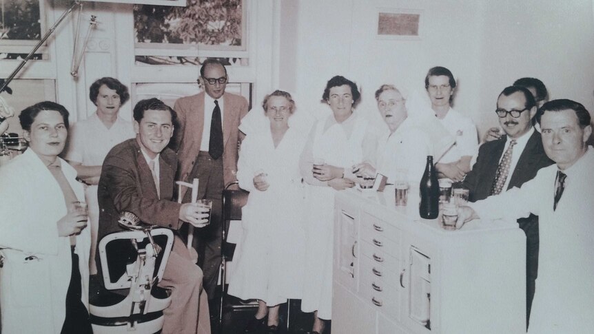 Archival photo of Dr Neil McConaghy with colleagues, approximately late 1950.