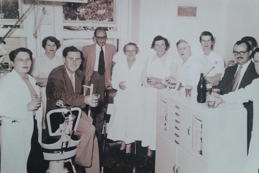 Archival photo of Dr Neil McConaghy with colleagues, approximately late 1950.