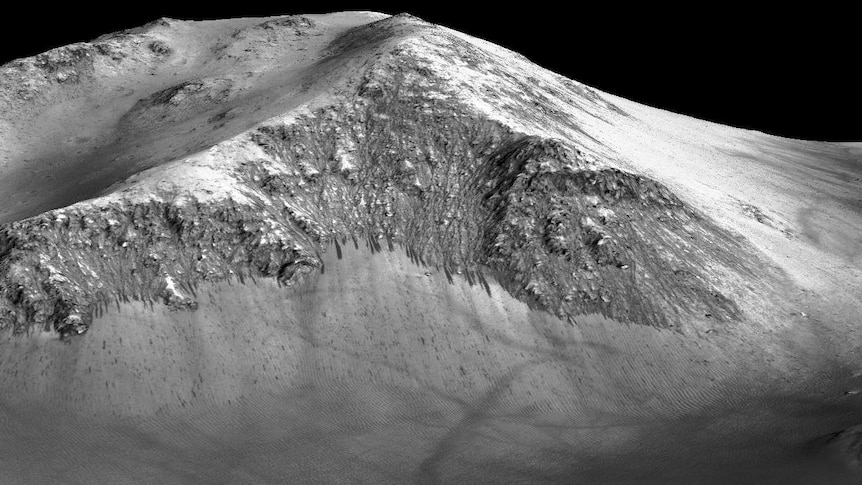 Dark streaks flowing downhill at Horowitz crater