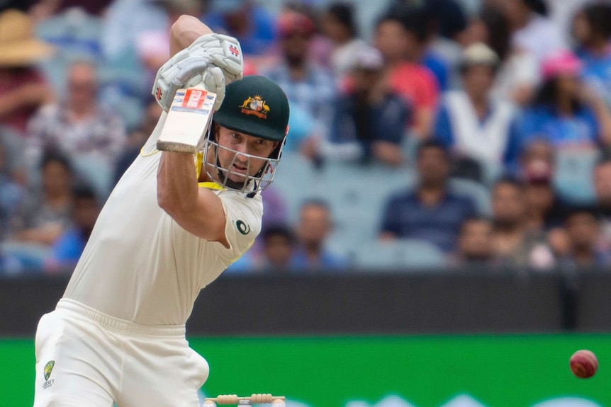 Australia batsman Shaun Marsh plays a powerful off drive during a Test against India at the MCG.