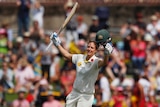 Ellyse Perry runs with her bat in her right hand and helmet in her left after she scored a century against England.