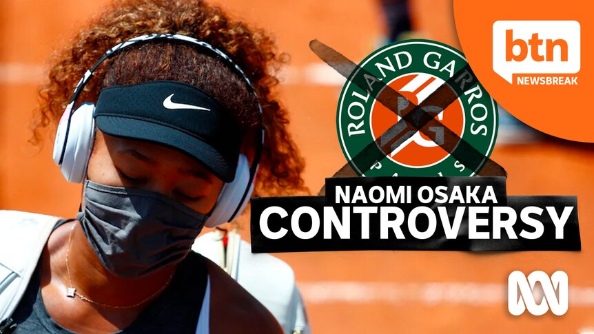 Naomi Osaka wearing a facemask walks on the tennis court. Roland Garros logo crossed out with marker.