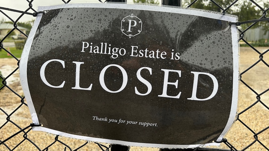 A closed sign covrering the gates to Pialligo Estate. 