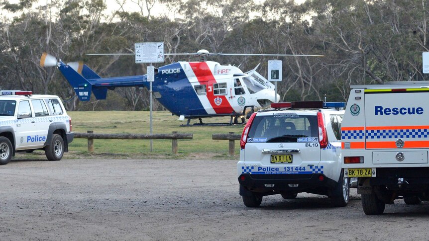 An emergency services helicopter sits on the oval at Leura.