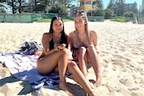 (LtoR) Prue Chuenchom and Alexis Butson sunbaking at Burleigh.