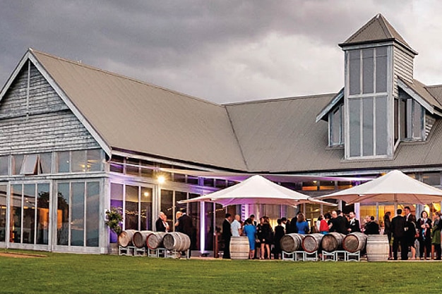 A group of people gather at a wedding venue