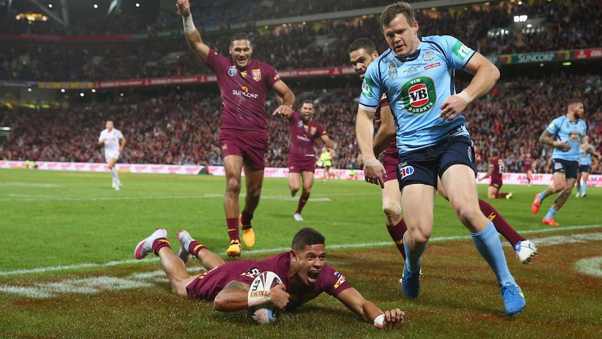 Dane Gagai of the Maroons celebrates scoring a try