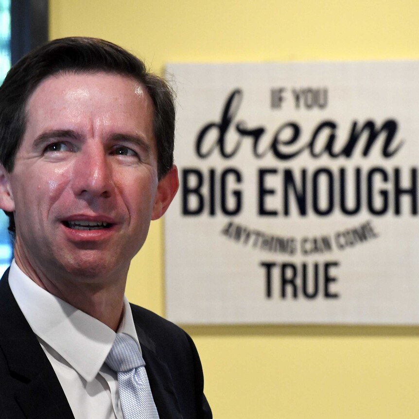 Simon Birmingham next to 'If you dream big enough anything can come true'
