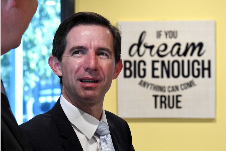 Simon Birmingham next to 'If you dream big enough anything can come true'