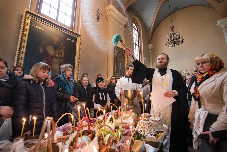 A Lithuania Orthodox priest blesses Easter cakes and eggs during a ceremony in Vilnius.