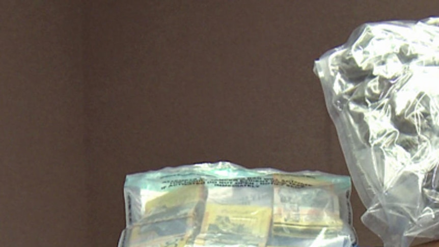 Drugs and cash seized by police