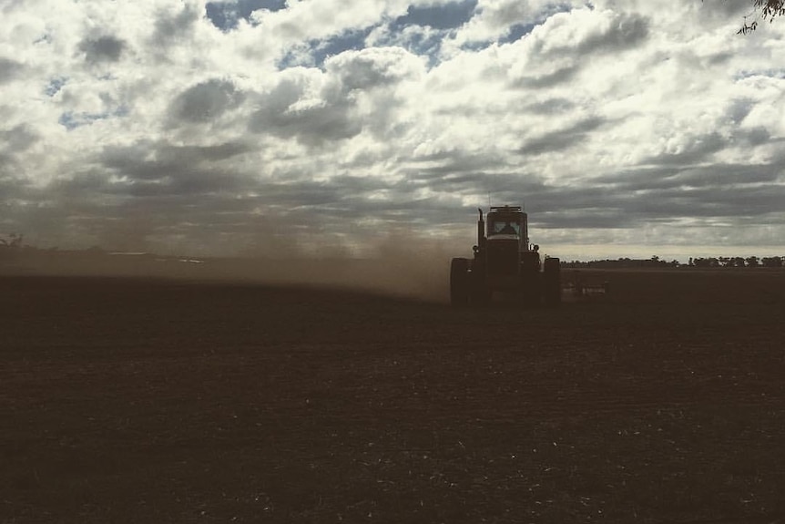 header sowing a dusty field