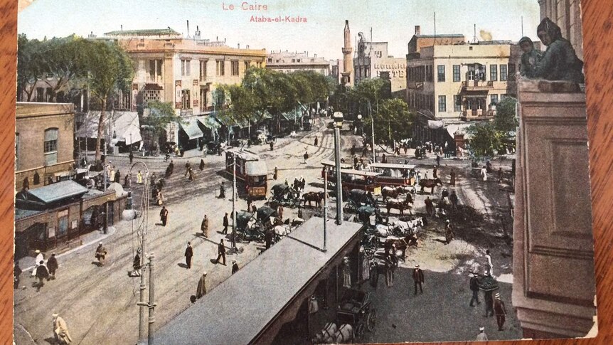 A vintage postcard of a busy Cairo street