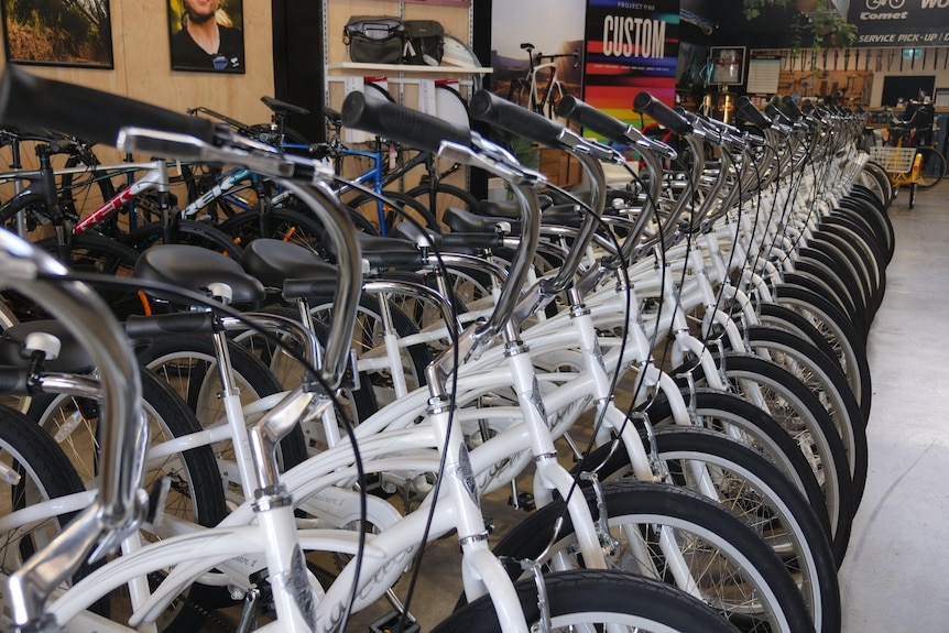 A line of bikes in a store 