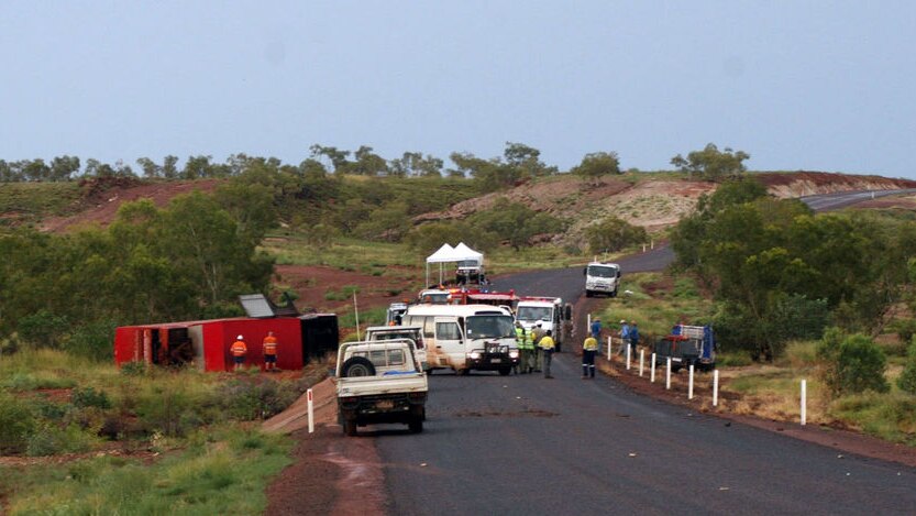 Northern Territory police arrive at the scene of a Greyhound bus rollover on the Stuart Highway