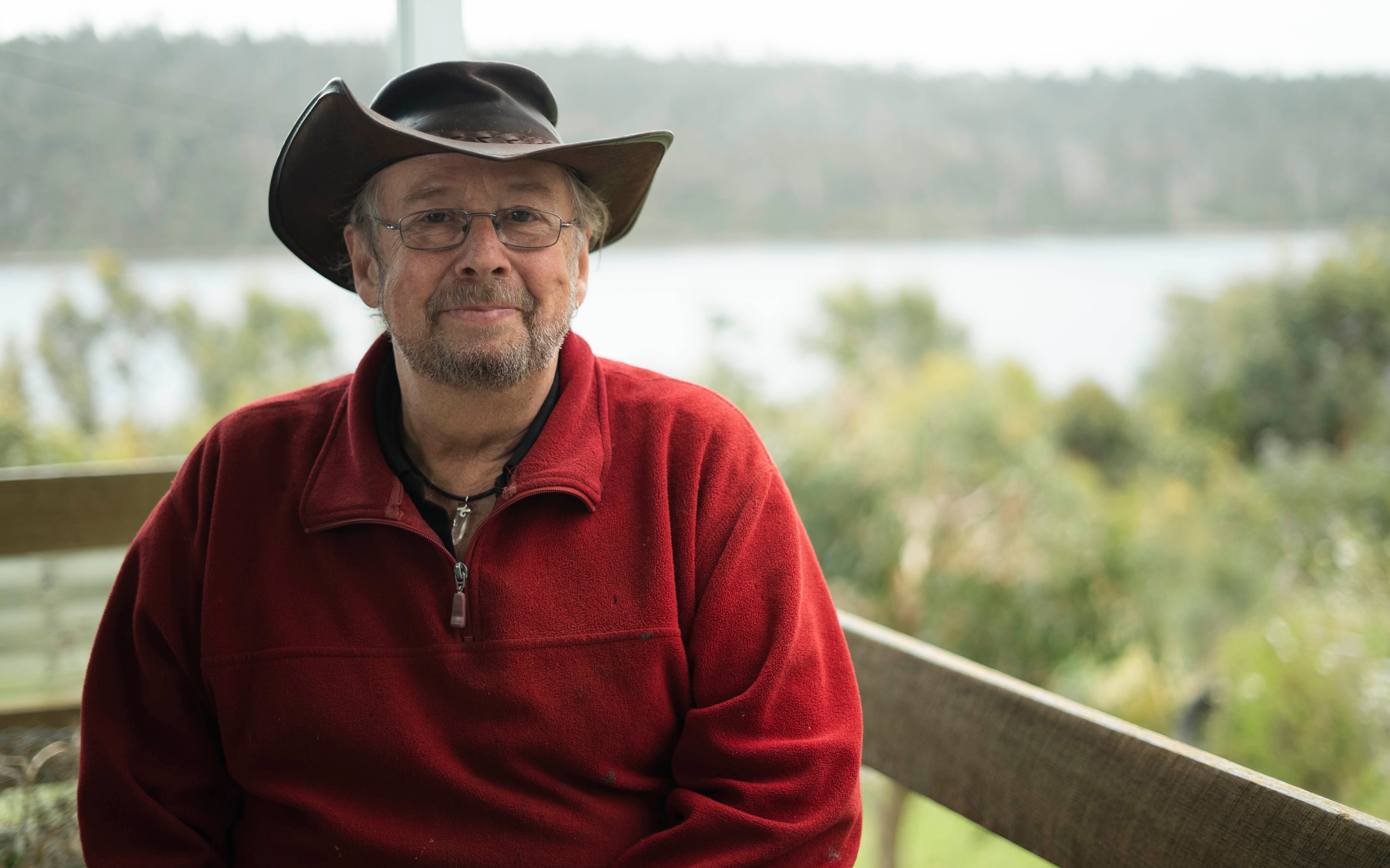 Portrait of Malcolm Battersby on the outside deck at his home.