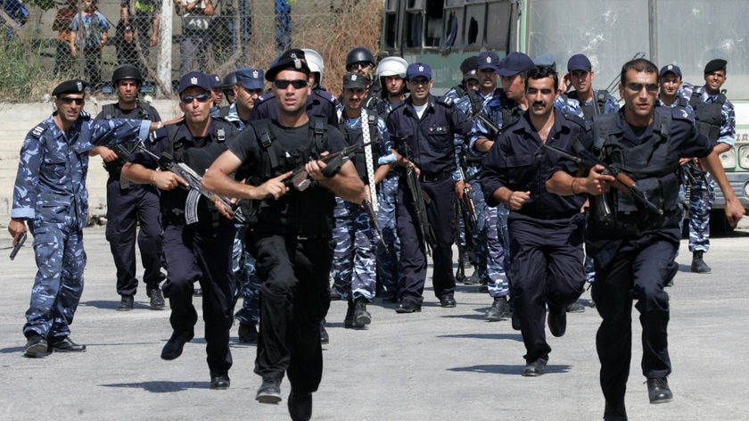 Palestinian police run during a training session in the West Bank city of Hebron [File photo].