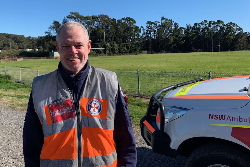 New South Wales Ambulance Inspector Matt Sterling standing in his uniform with a smile on his face.