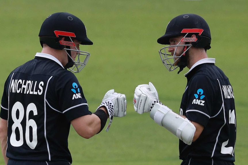 New Zealand batsmen Henry Nicholls and Kane Williamson are mid-fist bump during the Cricket World Cup final.